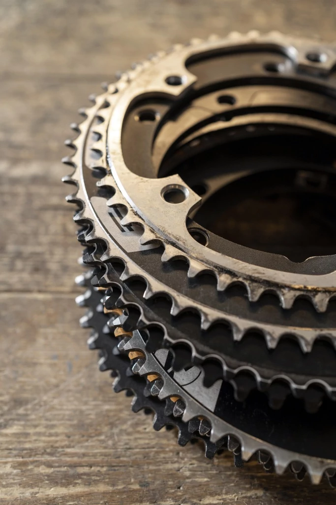 bicycle-pieces-wooden-table-high-angle.jpg